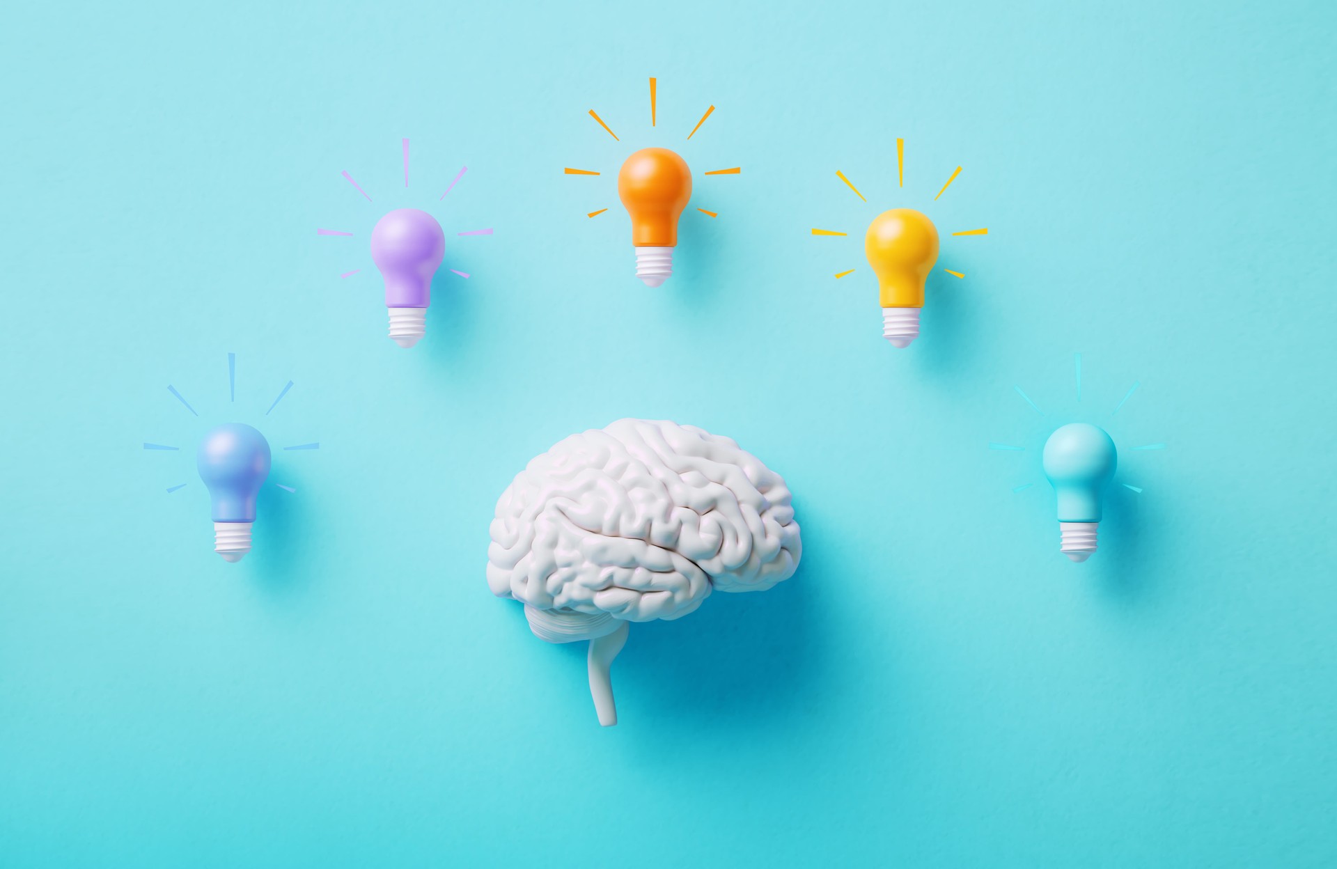 Neurodiversity And Creativity Concept - White Human Brain And Colorful Lightbulbs On Blue Background